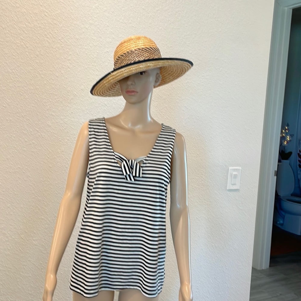 black and white sleeveless striped top with tie at neck size medium